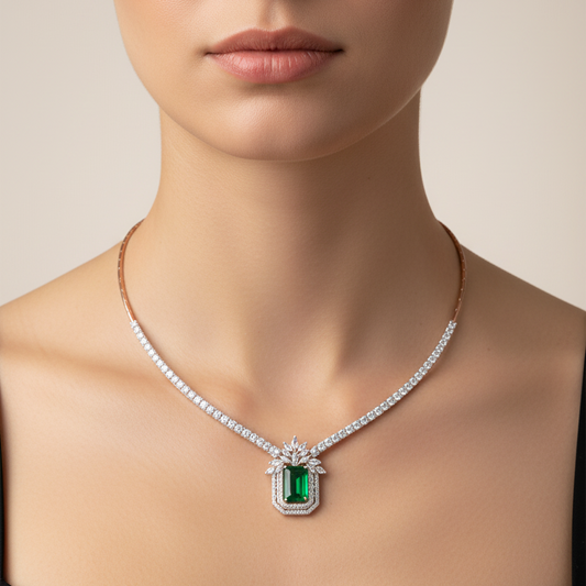 Female model wearing emerald and diamond necklace