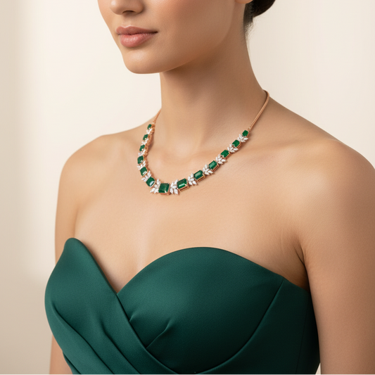 Female model wearing emerald and diamond necklace