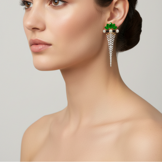 Female model wearing emerald and diamond statement earrings