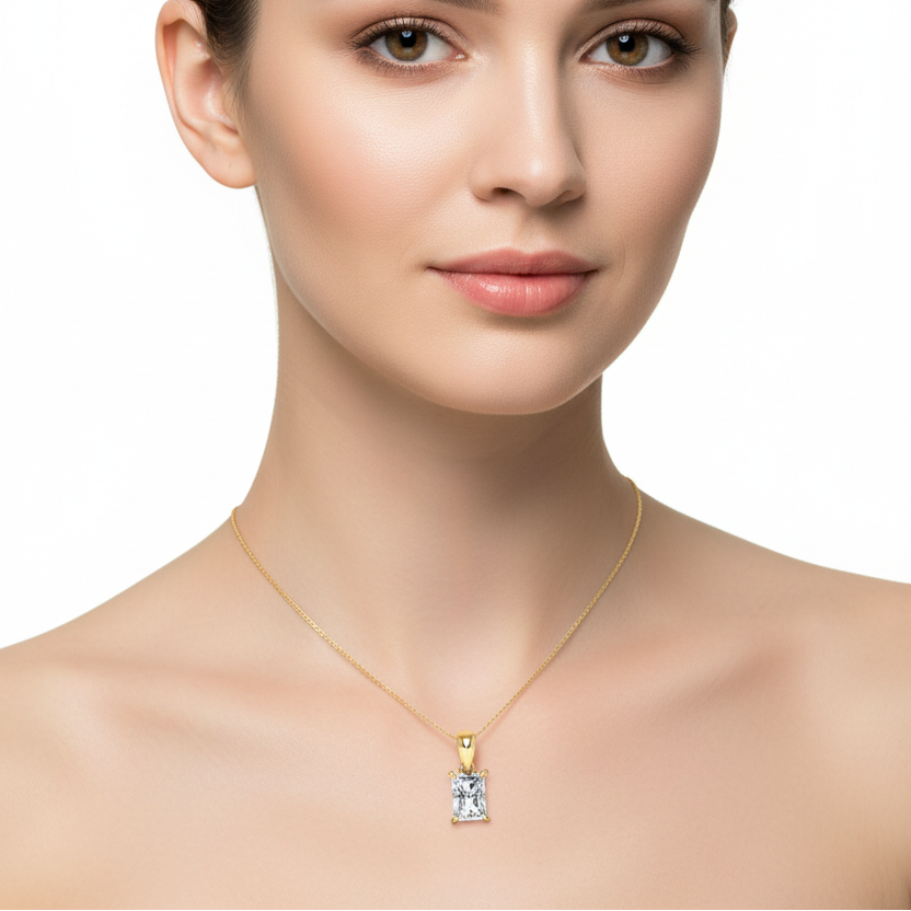 Female model wearing emerald-cut diamond pendant
