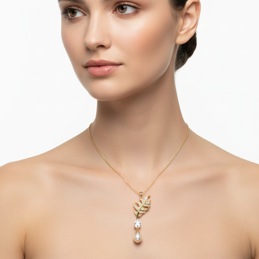 Female model wearing feather and pearl pendant