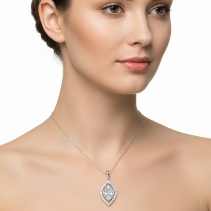 Female model wearing marquise-shaped diamond cluster pendant