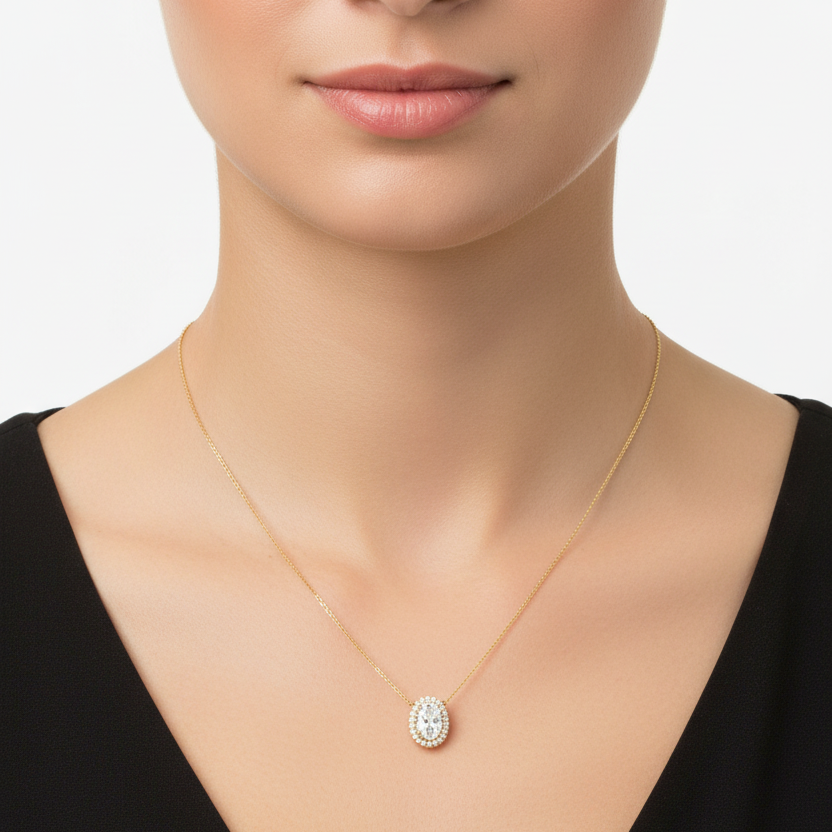 Female model wearing oval diamond halo pendant necklace
