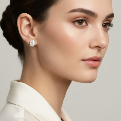 Female model wearing oval diamond stud earrings