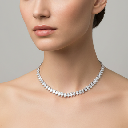 Female model wearing pear-shaped diamond necklace