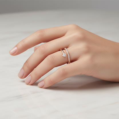 Female model wearing rose gold bypass heart diamond ring