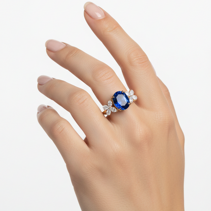 Female model wearing sapphire and diamond ring
