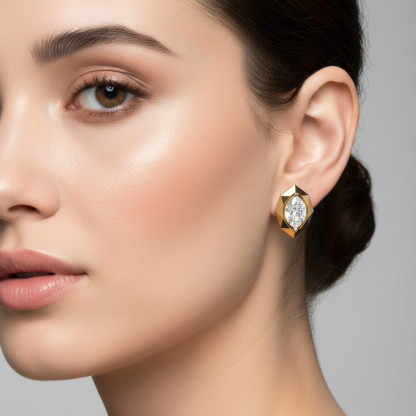 Female model wearing small marquise diamond yellow gold geometric stud earrings