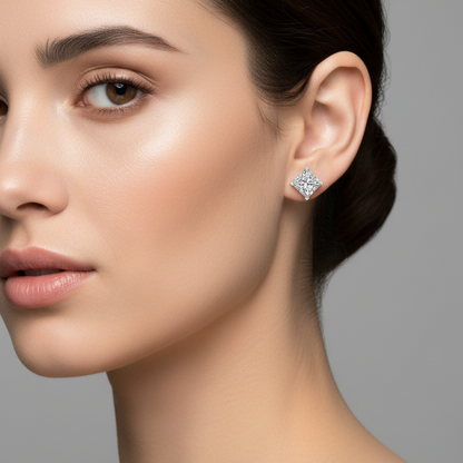 Female model wearing small princess-cut diamond stud earrings