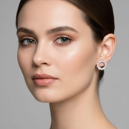 Female model wearing small rose gold open circle diamond stud earrings