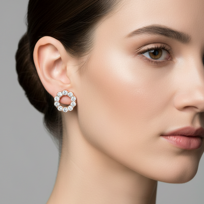 Female model wearing small rose gold open circle diamond stud earrings