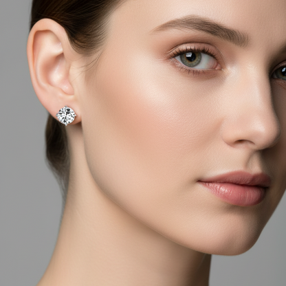 Female model wearing small three-prong martini diamond stud earrings