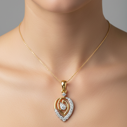 Female model wearing small two-tone yellow and white gold teardrop swirl diamond pendant necklace