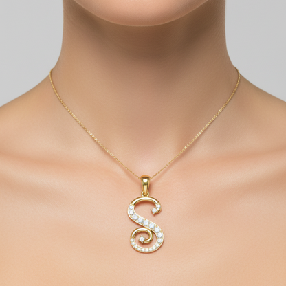 Female model wearing small yellow gold cursive letter S diamond pendant necklace