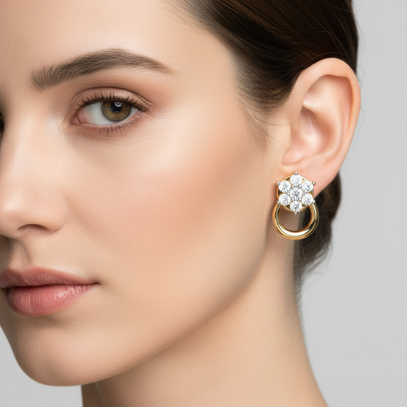 Female model wearing small yellow gold flower cluster diamond door-knocker stud earrings