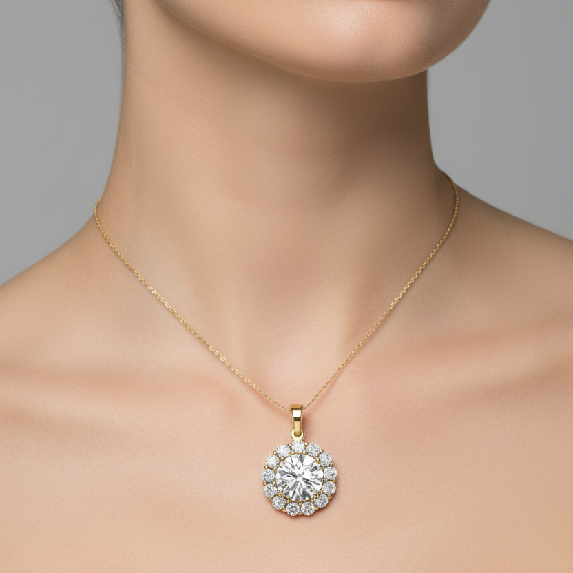 Female model wearing small yellow gold round brilliant diamond halo pendant necklace with large cluster