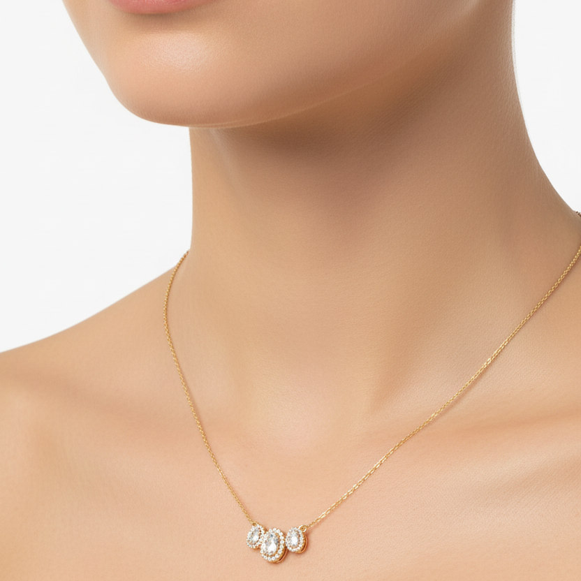 Female model wearing triple oval diamond halo pendant necklace