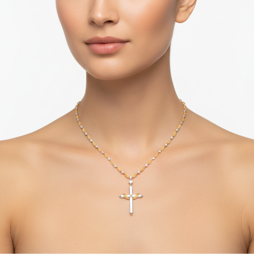 Female model wearing two-tone cross pendant necklace