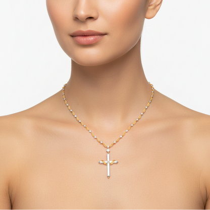 Female model wearing two-tone cross pendant necklace