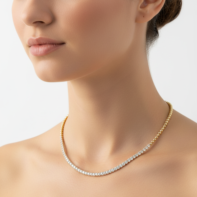Female model wearing two-tone diamond and gold bead necklace