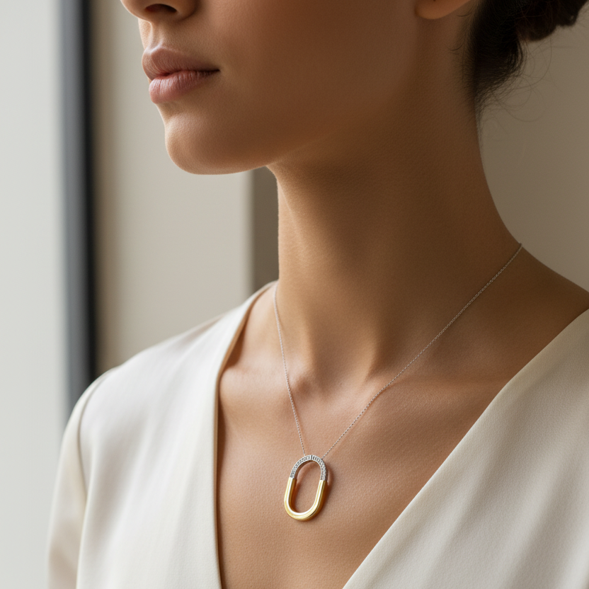 Female model wearing two-tone diamond pendant