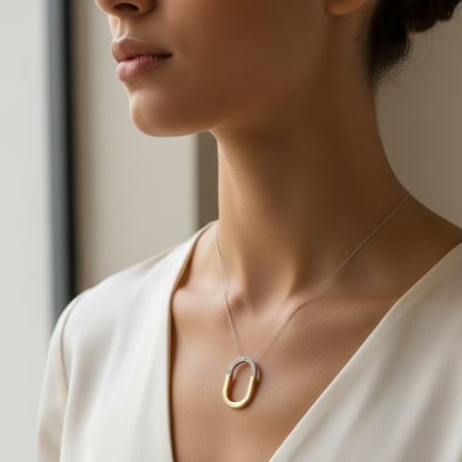 Female model wearing two-tone diamond pendant