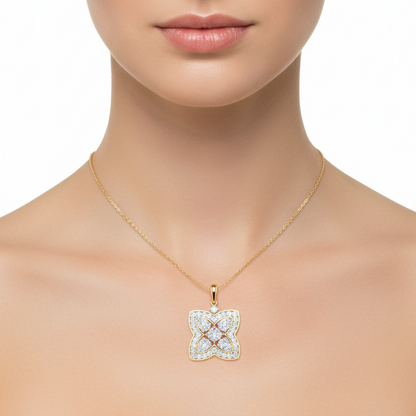 Female model wearing two-tone diamond quatrefoil pendant
