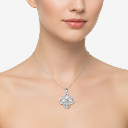 Female model wearing white gold diamond quatrefoil cluster pendant