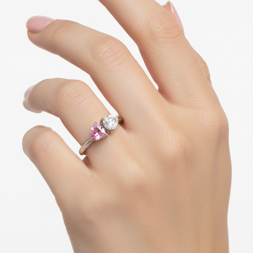 Female model wearing white gold toi et moi ring with pink sapphire and diamond