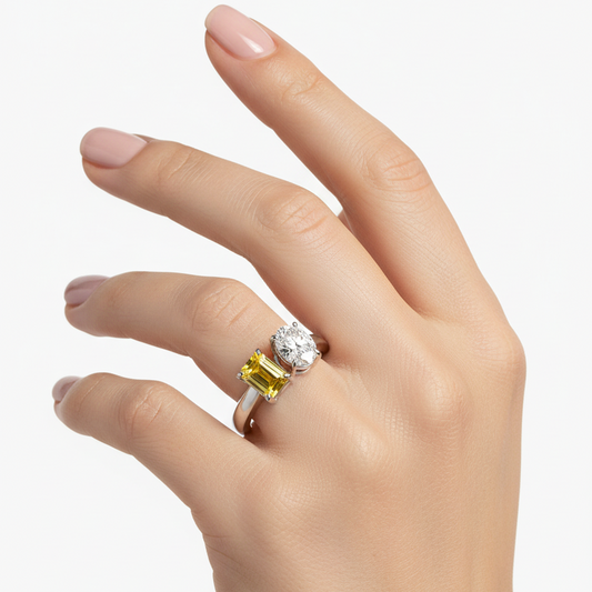 Female model wearing white gold toi et moi ring with yellow sapphire and diamond