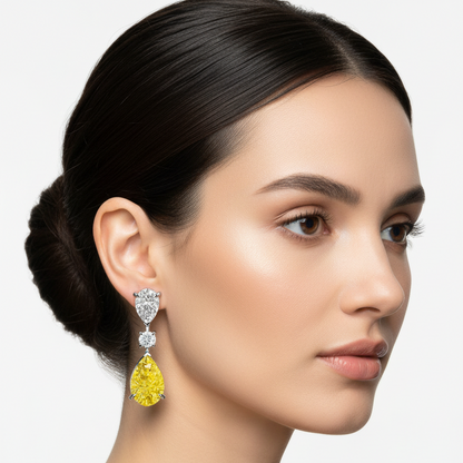Female model wearing white gold yellow sapphire and diamond drop earrings