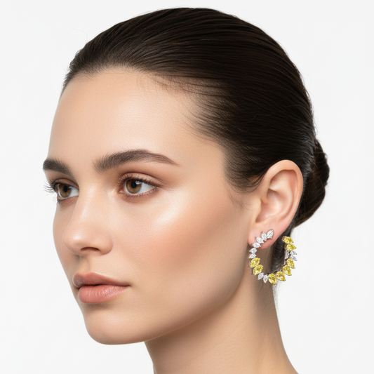 Female model wearing white gold yellow sapphire and diamond ear crawler earrings