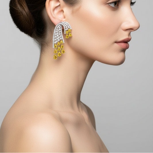 Female model wearing yellow and white diamond chandelier earrings