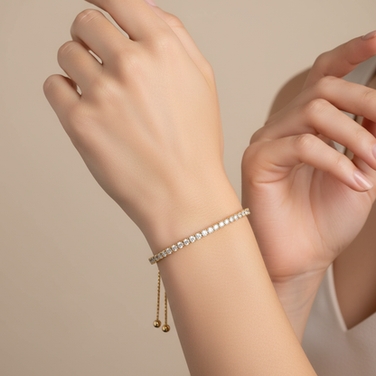 Female model wearing yellow gold adjustable diamond bolo bracelet