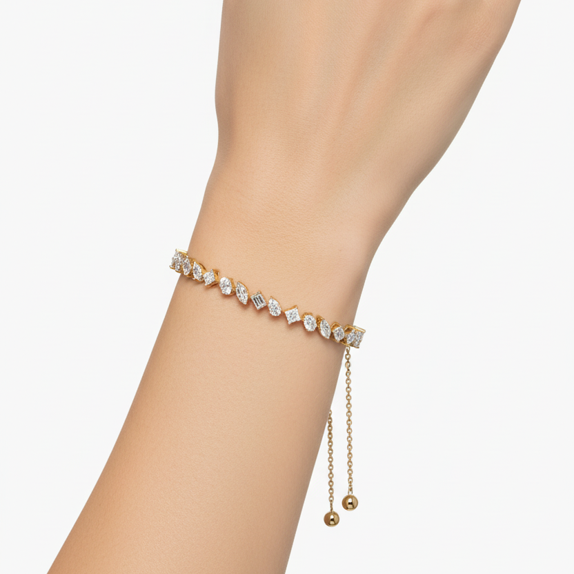 Female model wearing yellow gold adjustable mixed-cut diamond bracelet