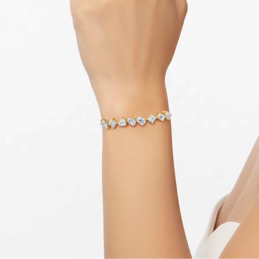Female model wearing yellow gold adjustable mixed-cut diamond bracelet