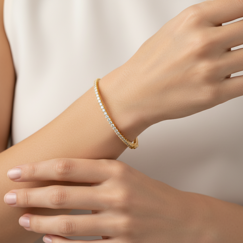 Female model wearing yellow gold diamond bangle bracelet