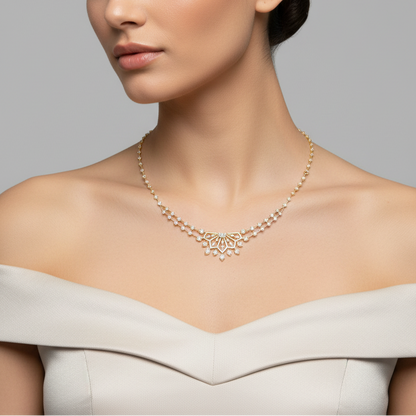 Female model wearing yellow gold diamond station necklace with central sunburst fan pendant