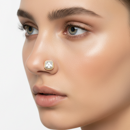 Female model wearing yellow gold emerald-cut diamond nosepin