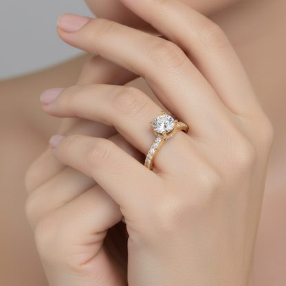 Female model wearing yellow gold round brilliant diamond hidden halo cathedral engagement ring with graduating pavé band