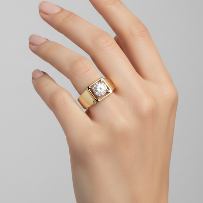 Female model wearing yellow gold two-tone round brilliant diamond solitaire ring with bold square tank setting