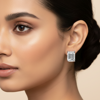 Generated alternate variation - Indian female model wearing the white gold emerald-cut diamond solitaire stud earrings, three-quarter side angle with warm golden hour lighting
