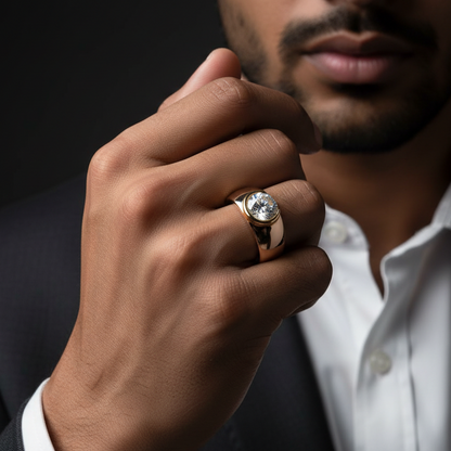 Generated dramatic cinematic male model variation - handsome Indian male model wearing the two-tone rose gold and yellow gold round brilliant diamond solitaire ring with crescent moon yellow gold half-bezel setting flush within a dramatically wide domed plain rose gold shank, strong directional side light against near-black background with powerful confident raised hand pose and dark charcoal suit