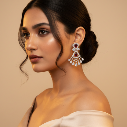 Generated fresh variation - Indian female model wearing the white gold ruby and diamond double fan chandelier earrings in very small size, three-quarter side angle warm golden backlit lighting on champagne background with contemporary ivory styling