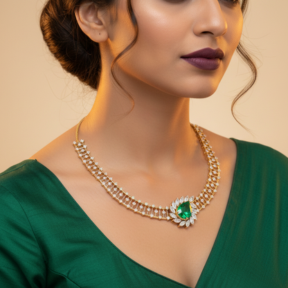Generated fresh variation - Indian female model wearing the yellow gold open ladder bib necklace with pear emerald and marquise diamond botanical fan centrepiece, three-quarter angle warm golden backlit lighting on champagne background with emerald green bridal styling