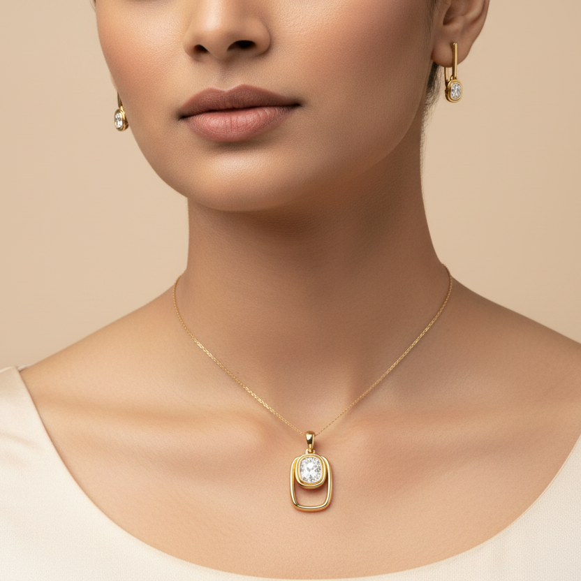 Woman wearing a gold necklace with a pendant on a beige background