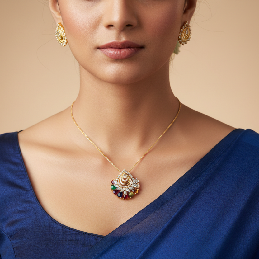 Woman wearing a blue saree with gold jewelry including earrings and a necklace on a beige background