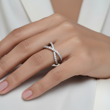Hand wearing a silver ring on a white background