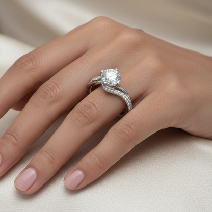 Close-up of a hand wearing a diamond ring on a neutral background