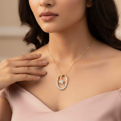 Generated image of a beautiful Indian female model wearing the yellow gold open oval pavé diamond pendant with sweet heart accent cluster floating within the open oval frame on a delicate slim yellow gold chain at her collarbone, warm golden hour light on champagne background with open neckline ivory silk outfit and soft romantic waves hairstyle